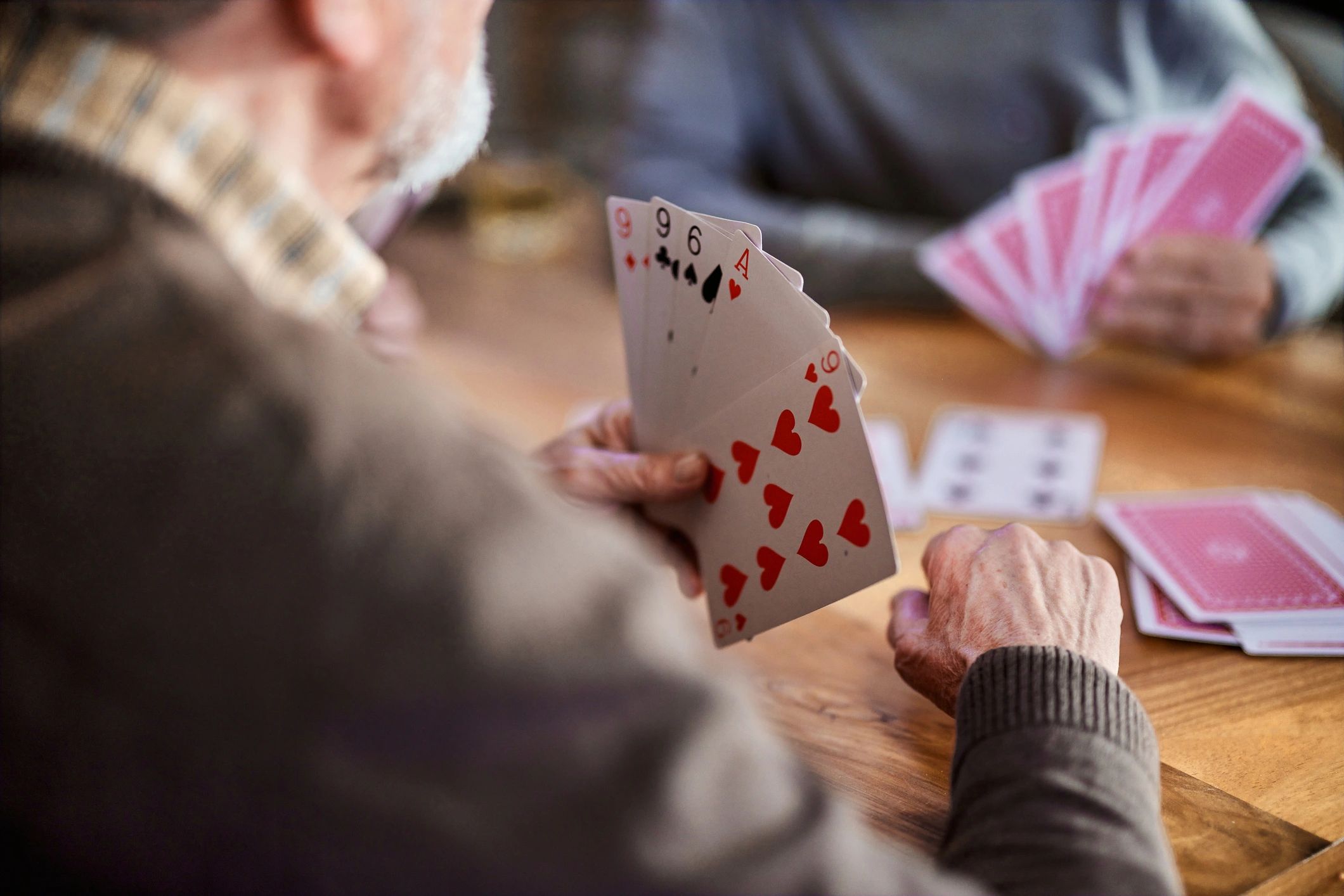 Customer enjoying a card game at home